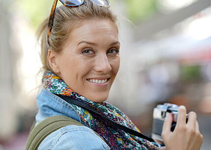 Woman outside with camera