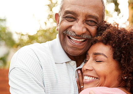 Older African-american couple hugging